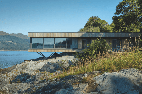 A Kebony wooden house between sky and sea